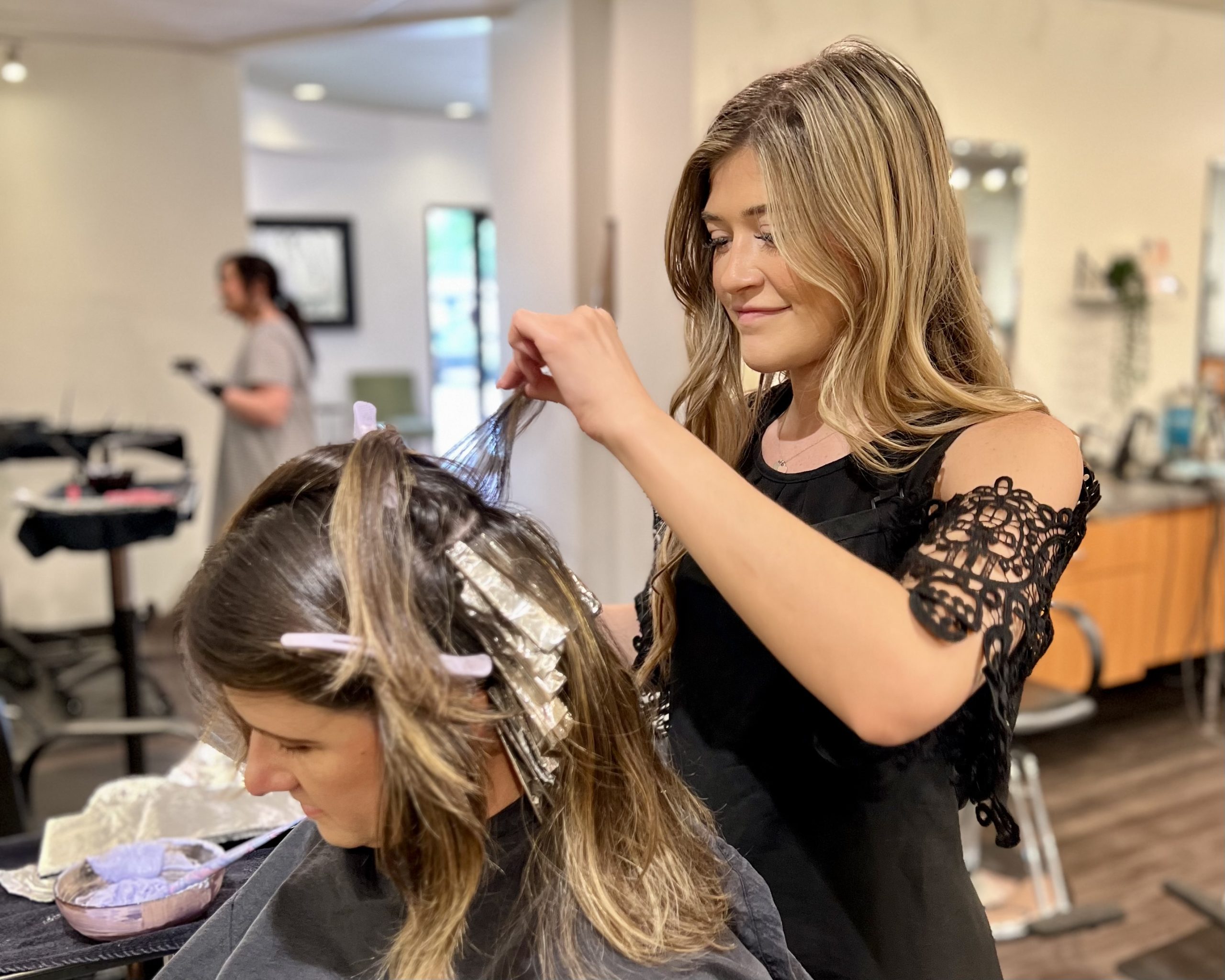 Our stylist Jaidyn highlights our stylist's Cara hair.