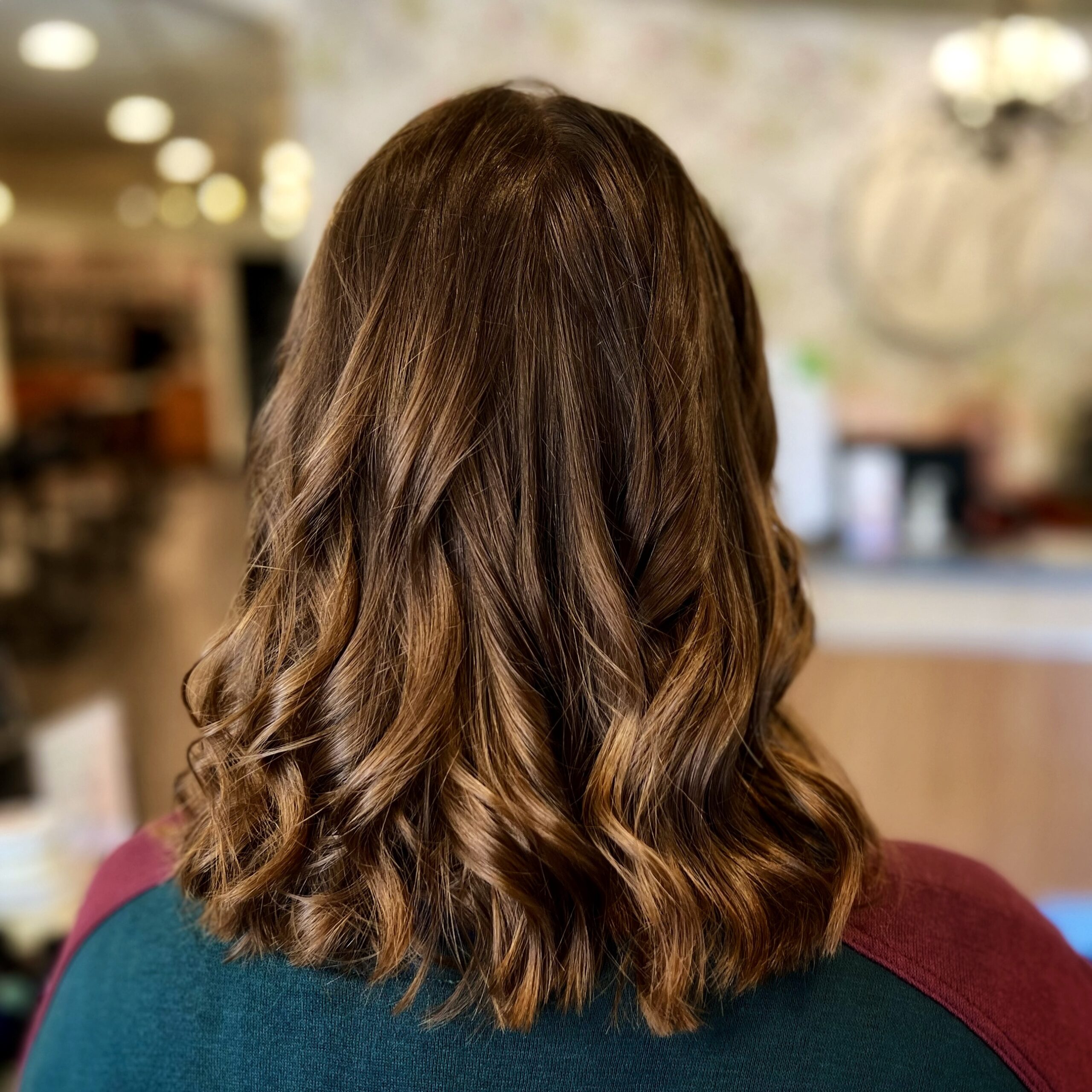 Our marketing manager Nicole shows off her curled hairstyle after receiving our Mint Condition Detox Hair Treatment with our stylist Hannah.