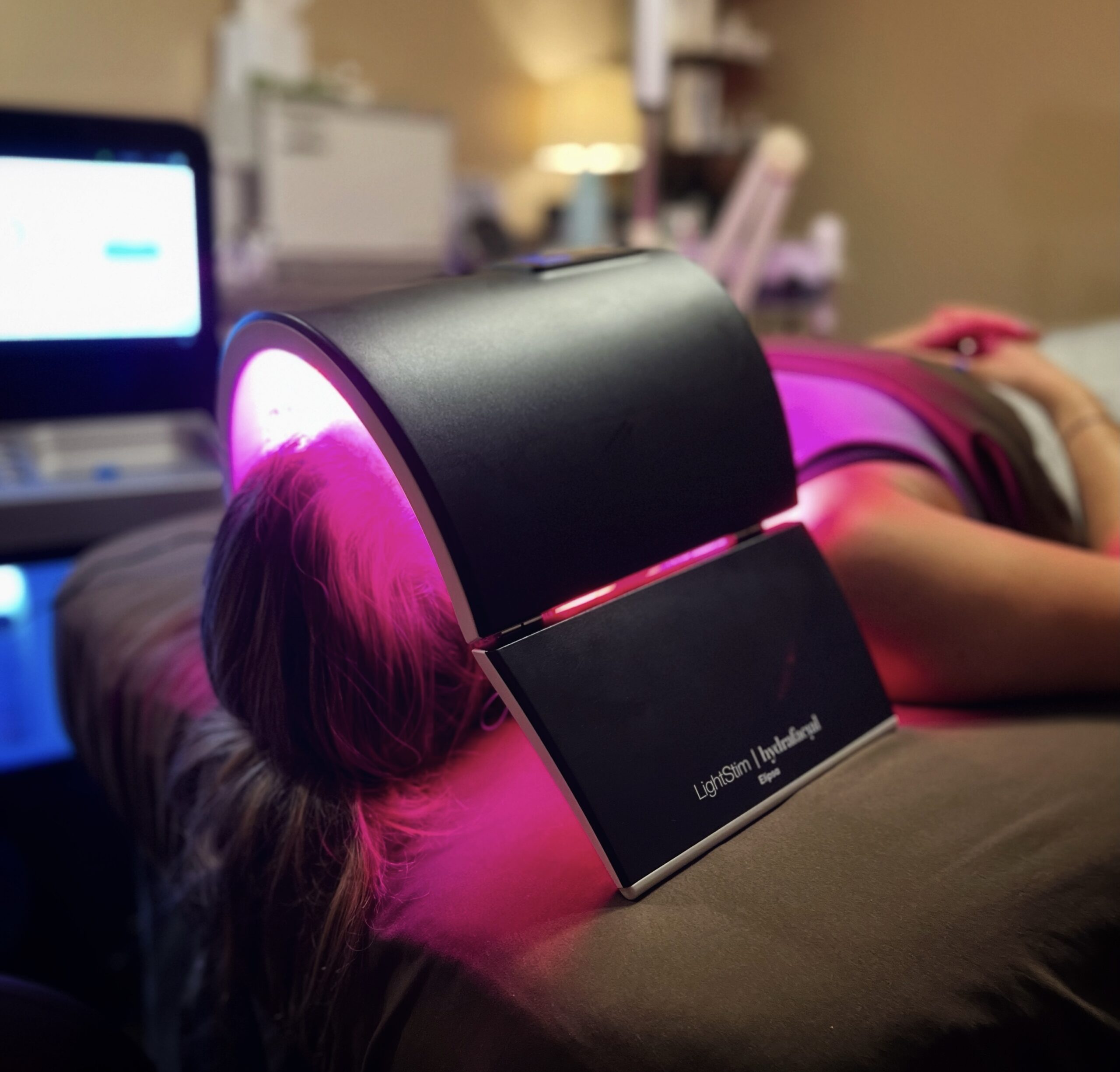 One of our spa guests receives red LED light therapy during her HydraFacial.