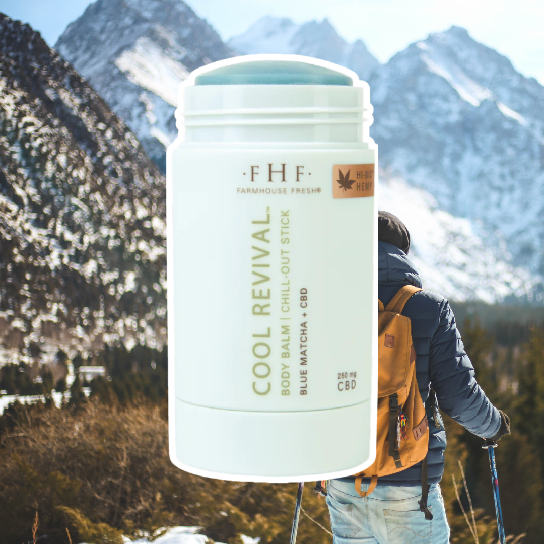 FarmHouse Fresh Cool Revival Body Balm outlined in white, set against a scenic snowy mountain backdrop featuring a man hiking with a yellow backpack.