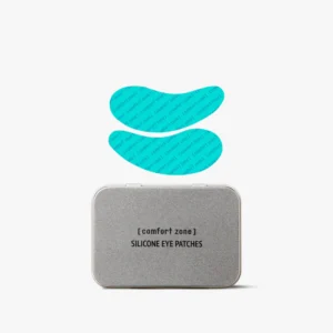 A silver rectangular tin labeled "Hydramemory Hyalu-Daily Sheet Masks (Copy)" with two blue silicone eye patches displayed above it on a white background. - Tyler Mason Salon + Spa in Indianapolis, IN
